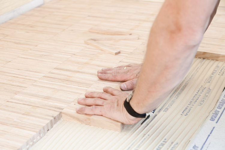 Place the wood flooring with a slight sliding motion into the adhesive bed and press down. Ensure full wetting of the back of the wood flooring. The area can be sanded and is ready for traffic after 48 hours (at 20 °C and 65 % relative humidity).
