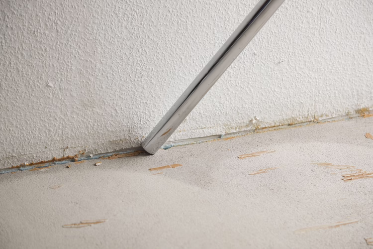 Vacuum thoroughly with an industrial vacuum cleaner.