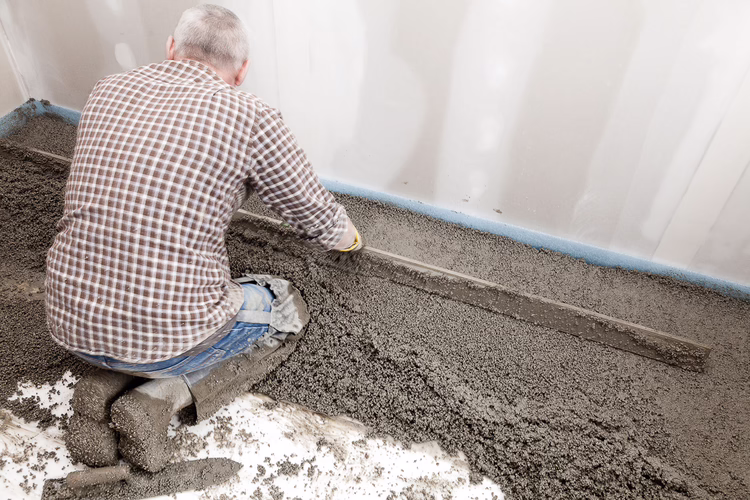 After mixing, the screed should be spread to the desired thickness using a rake and screed trowel before being and drawn level using a straightedge.