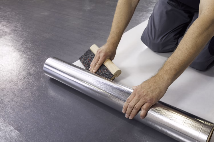 Install the Sigan Elements Plus sheets across the UZIN RR 185 and roll down firmly.